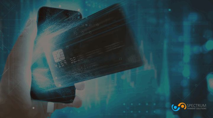 Hand holding smartphone with digital credit card graphic overlay, representing secure online payment processing by Spectrum Payment Solutions